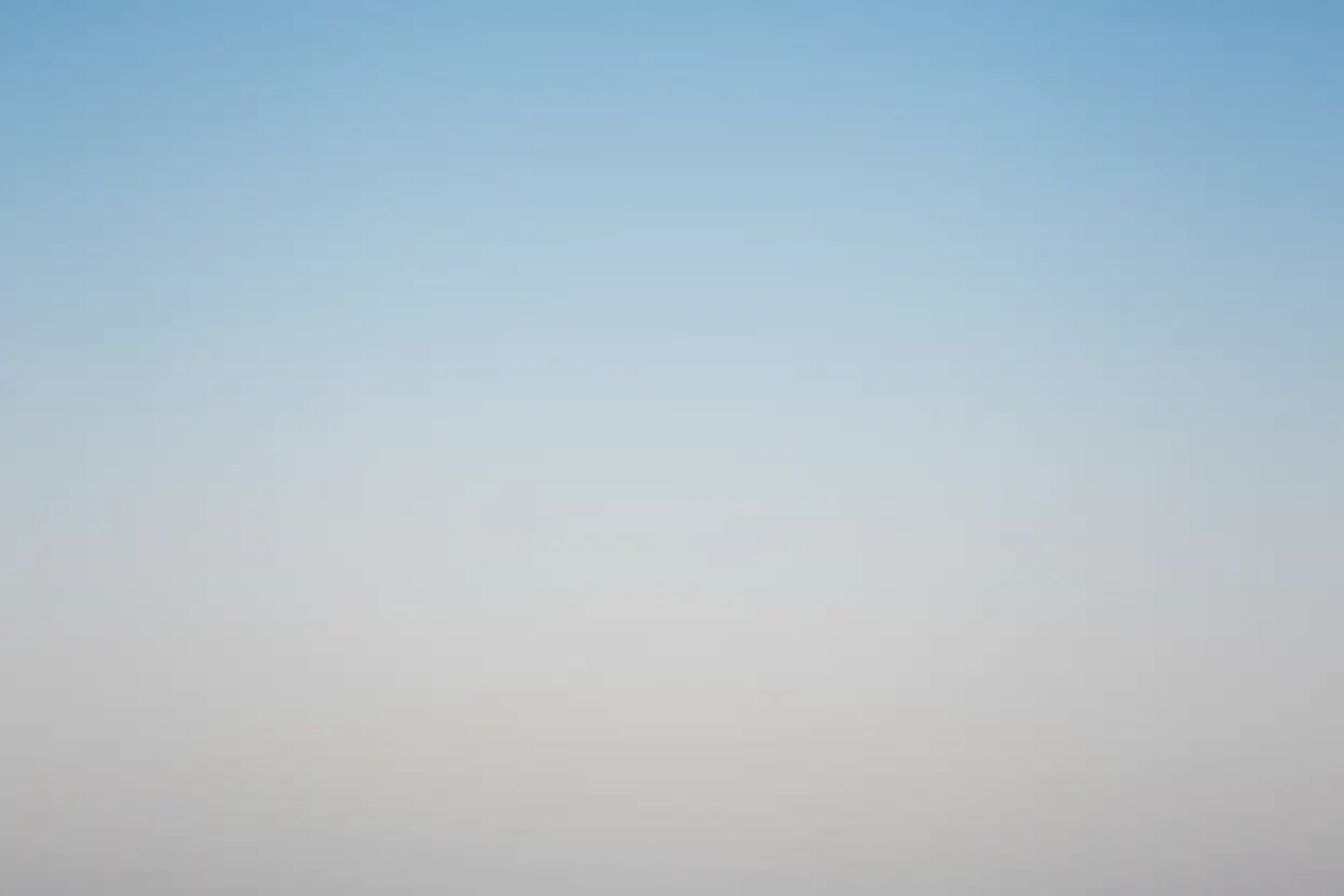 Gradient background transitioning from light blue to light grey